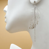 CLOSEOUT* Earrings - Rhodium Plated. Feather with crystals. Lightweight.